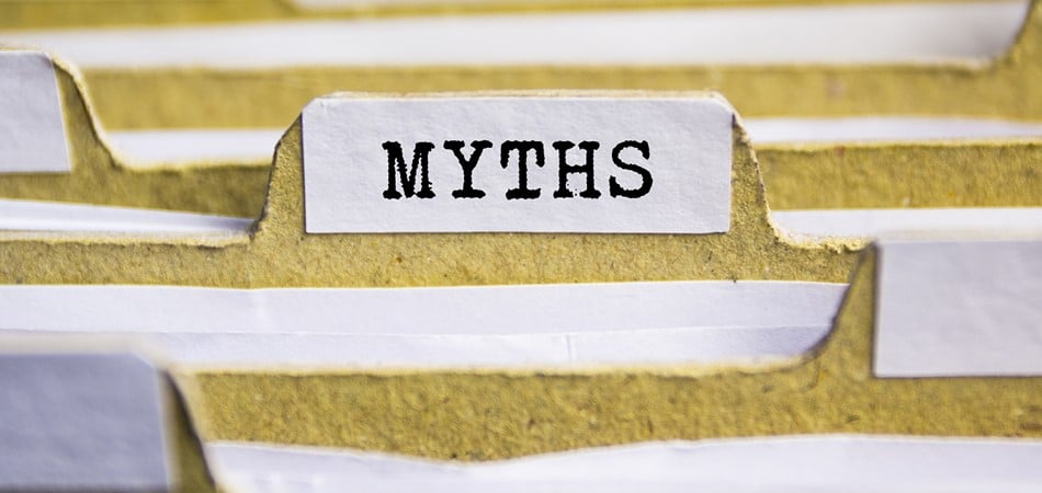 A close up of a paper folder tab that reads 'Myths'