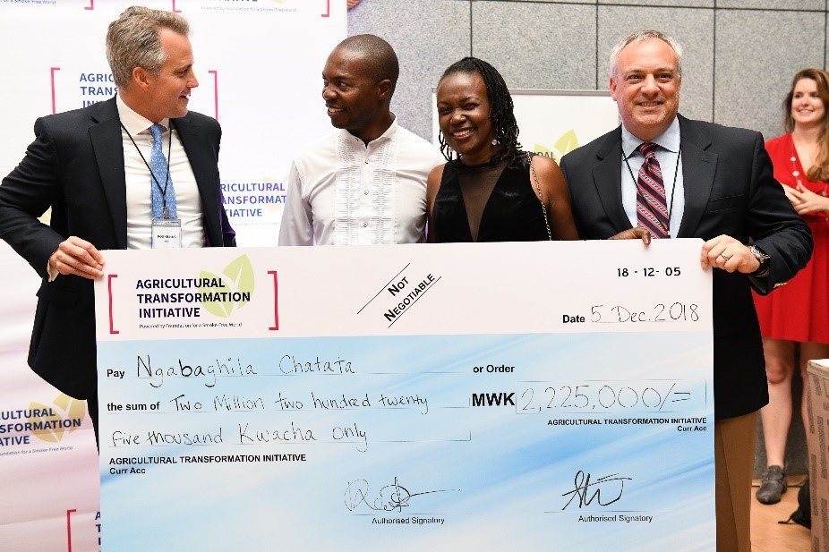 Check being presented to someone at an Agricultursl Transformation Initiative event