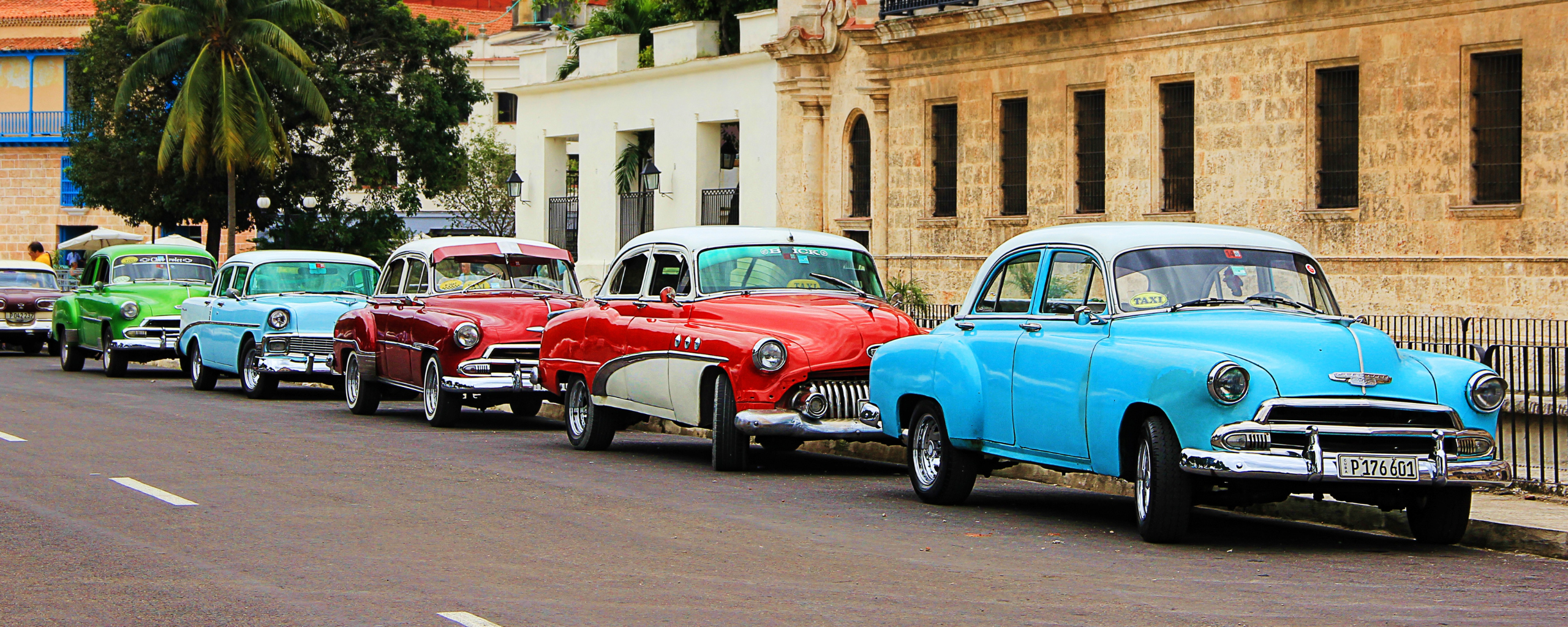 Classic cars lined up in Cuban street